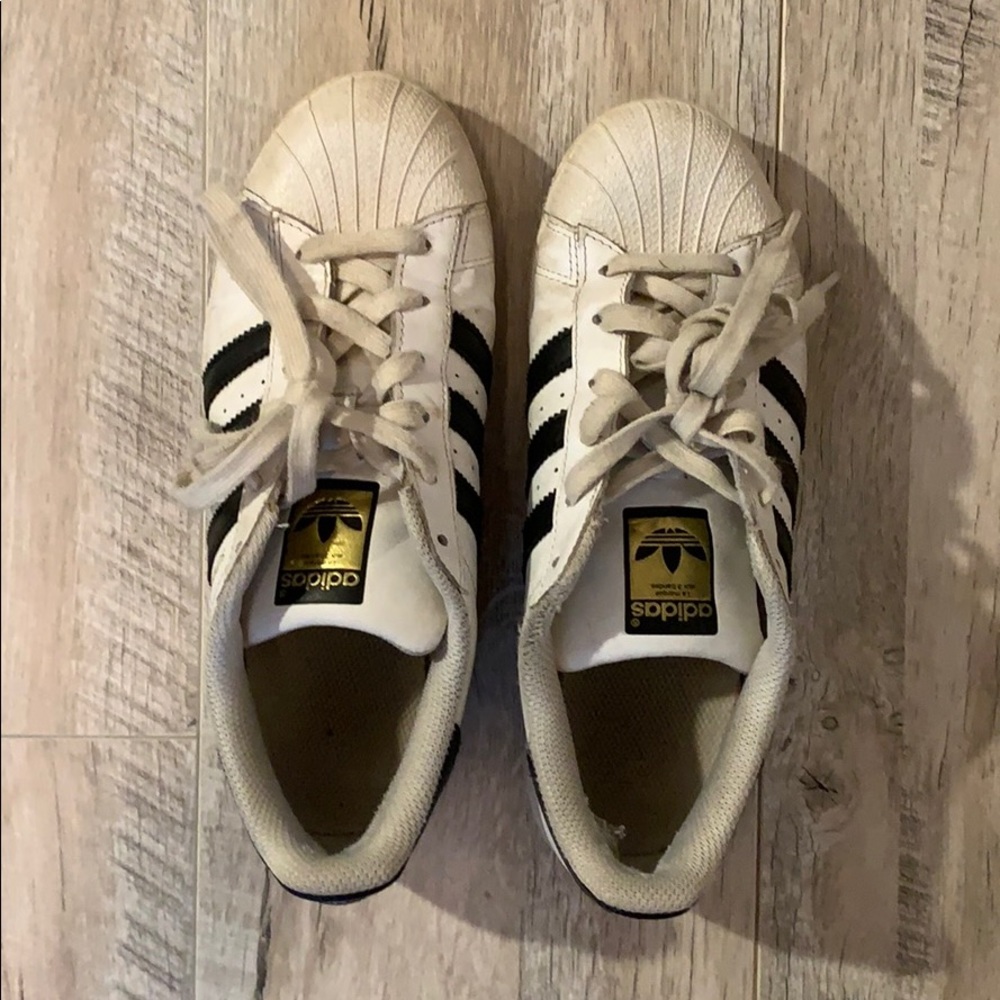 pair of adidas superstars